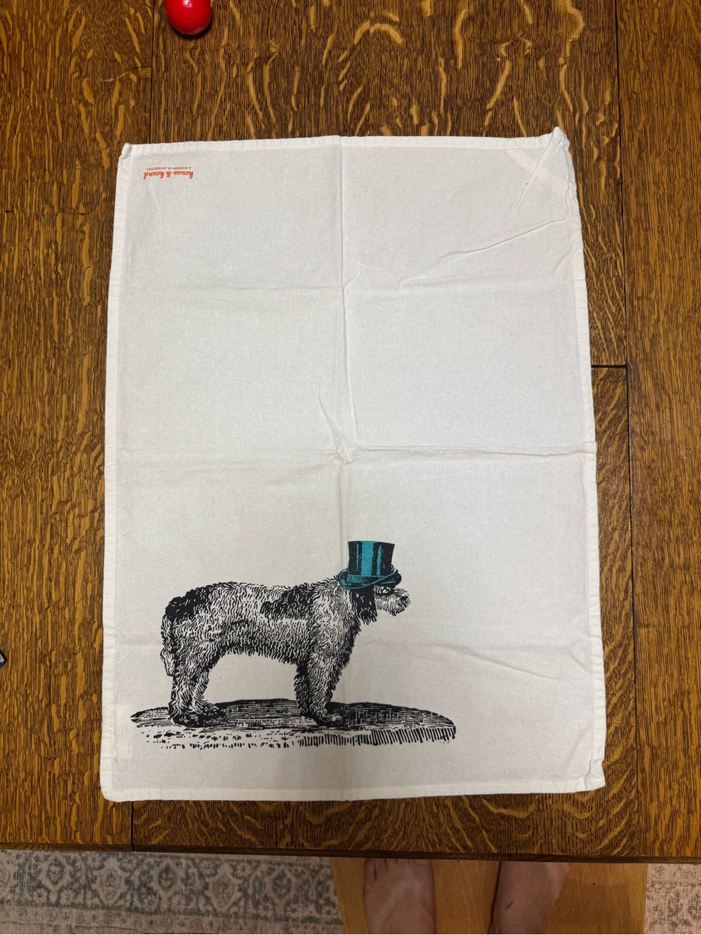 Cream Doodle Tea Towel with Teal Hat Accent